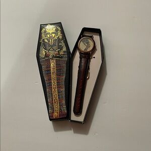 The watch featured is a vintage Papyrus Watch Collection watch with a Nefertiti